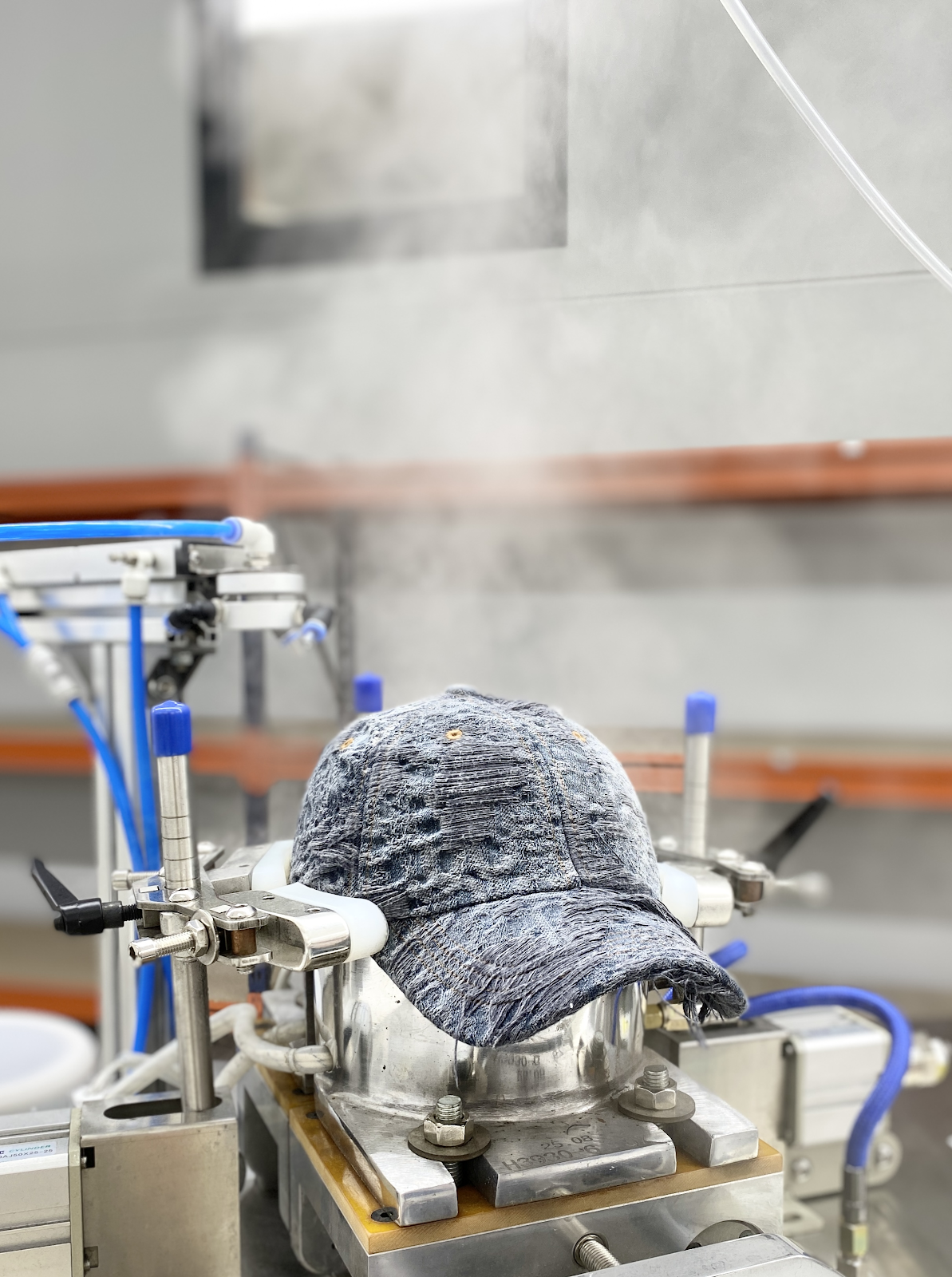 A cap being shaped with specialist equipment
